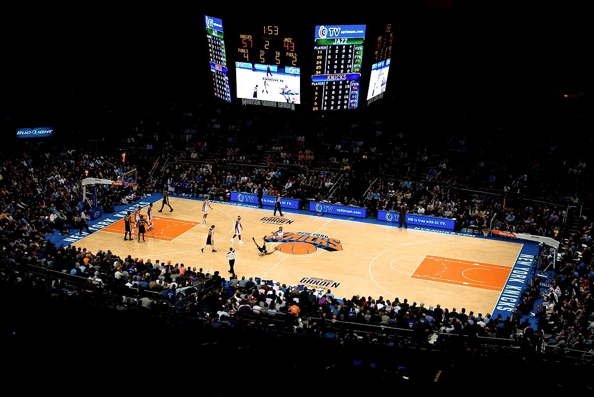 Madison Square Garden interior during a New York Knicks game, showing the court and packed stands