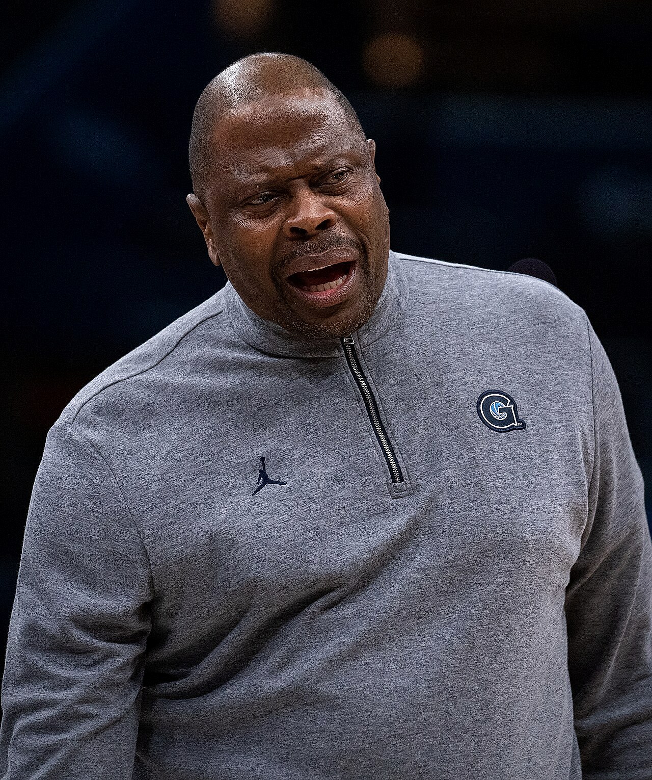 Patrick Ewing shooting a jump shot in a New York Knicks uniform