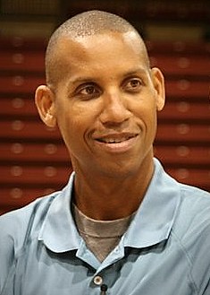 Reggie Miller shooting a jump shot in an Indiana Pacers uniform
