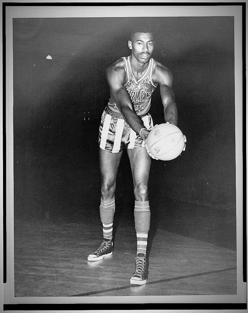 Wilt Chamberlain in a Harlem Globetrotters uniform holding a basketball, photographed in 1959